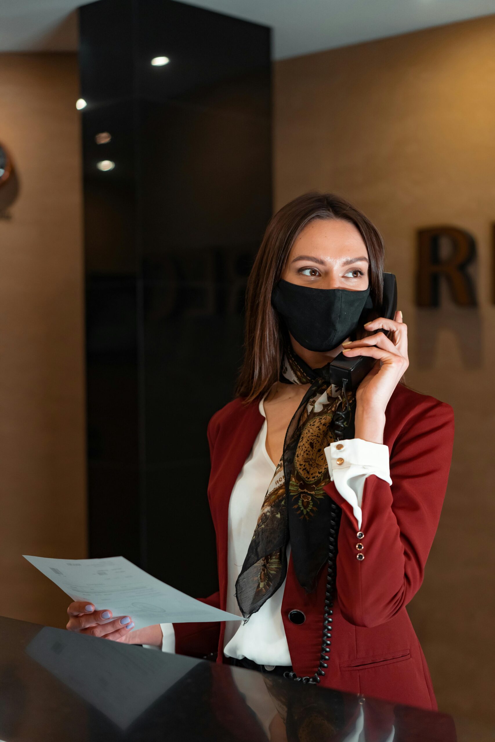 Hotel receptionist on the phone